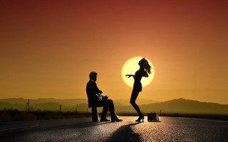 Sunset mountains silhouette outdoors surreal - the sun setting behind them free wallpaper