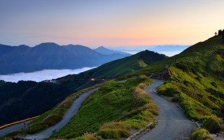 Mountain road clouds hill person - road free wallpaper