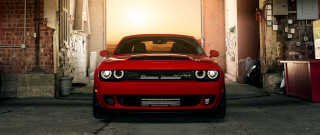 Red car garage brick wall 2 - a red car free wallpaper