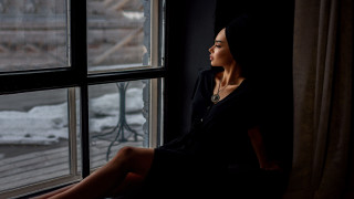 Woman sitting window sill snowy - a window sill free wallpaper