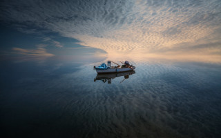 Boat lake cloudy sky person - top of a lake under a cloudy sky free wallpaper