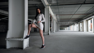 Woman leaning wall white dress - against free wallpaper