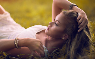 Woman lying grass ponytail jewelry - a woman free wallpaper for desktop