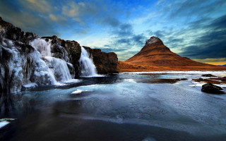 Waterfall mountain ice lake beach - a mountain in the background and a body of water free wallpaper