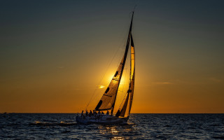 Sailboat sunset ocean reflection ceramic - a sailboat free wallpaper