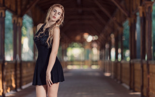 Woman black dress posing arcade - covered free wallpaper