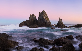 Rocky beach waves pink sky - wave free wallpaper