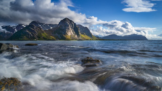Mountain range waterfront waves beach - widescreen free wallpaper