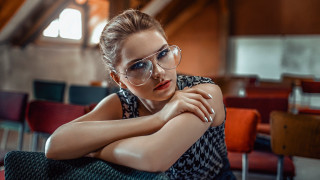 Woman glasses sitting crossed arms - glass free wallpaper