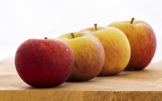 Apples wooden table white background - a wooden surface free wallpaper