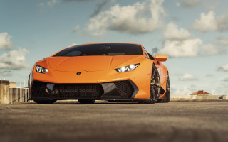 Orange sports car clouds blue - nice free wallpaper