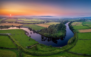 Lush green river sunset landscape - a green field free wallpaper