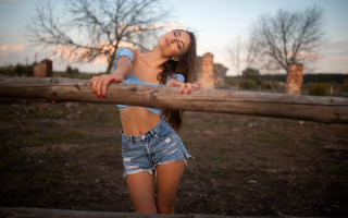 Woman leaning fence smiling autumn - a wooden fence free wallpaper