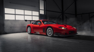 Red sports car garage smokestack - a garage free wallpaper