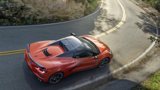 Red sports car winding road - a cliff side free wallpaper