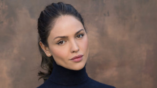 Woman black turtleneck brown background - a pair of earrings free wallpaper