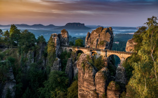 Mountain bridge train valley river - a mountain range in the background free wallpaper