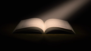 Open book light on table - graphic novel free wallpaper