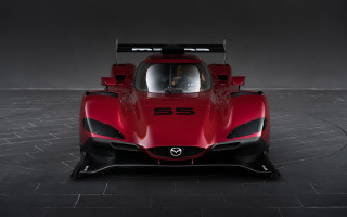 Red sports car black floor - a white circle free wallpaper