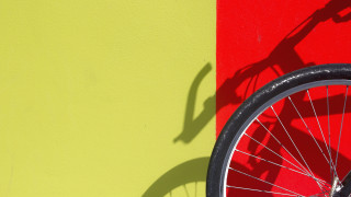 Bike shadow wall red yellow - against a wall free wallpaper