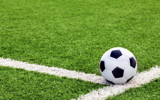 Soccer ball field tiltshift green - free sports wallpaper