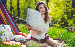 Woman sitting pillow outdoors nature - product photo free wallpaper