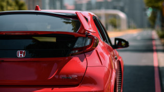 Red car street sign building - the side of a road next free wallpaper