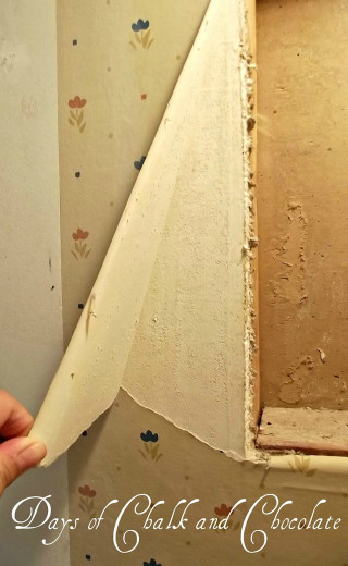 Person holding paper window torn - torn free wallpaper