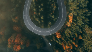 Curved road forest car autumn - bernd fasching free wallpaper