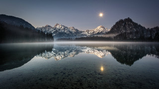 Moon mountain lake city sunset - a lake in the foreground free wallpaper