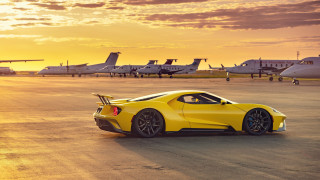Yellow sports car runway sunset - f 8 aperture free wallpaper