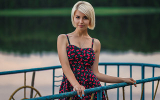 Woman dress rail lake bike - a lake in the background free wallpaper