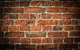 Brick wall pattern textured cityscape - a white border free wallpaper