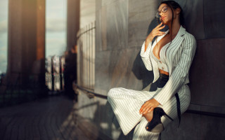 Woman white suit phone cigarette - against free wallpaper