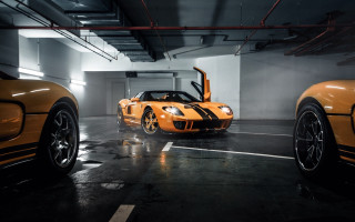 Orange sports cars parking garage - a parking garage free wallpaper