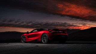 Red sports car sunset dark - a dark sky in the background free wallpaper