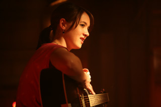 Woman guitar distance dark background - her free wallpaper