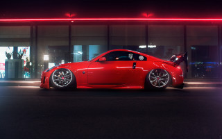 Red sports car night building - rim free wallpaper