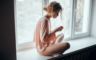 Woman sitting window snow romanticism - soft free wallpaper