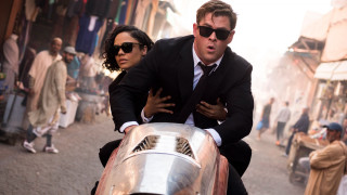 Motorcycle rider woman suit sunglasses - imax 70 mm footage free wallpaper for desktop