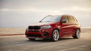 Red bmw suv ocean sand - a cloudy sky free wallpaper for desktop