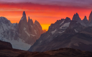 Mountain range red sky clouds - a red sky in the background free wallpaper