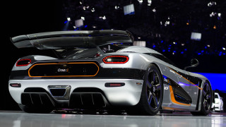 White black sports car showroom - andrew law free wallpaper