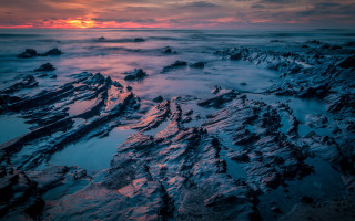 Rocky beach snowy sunset cloudy - rich moody colour free wallpaper