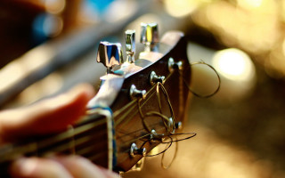 Guitar player strings ashbaugh bokeh - a person playing free wallpaper
