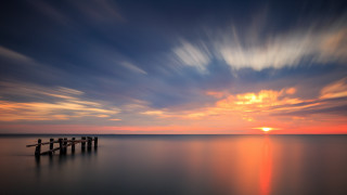 Sunset ocean dock misty colors - mystical free wallpaper