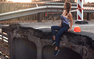 Woman sitting concrete wall orange - a concrete wall free wallpaper