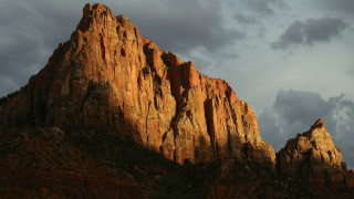 Mountain rockface cloudy sky evening - under free wallpaper