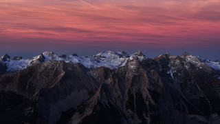 Mountain range pink sky plane - a view of a mountain range free wallpaper