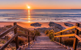 Stairs beach sunset rocks sand - a set of stairs free wallpaper